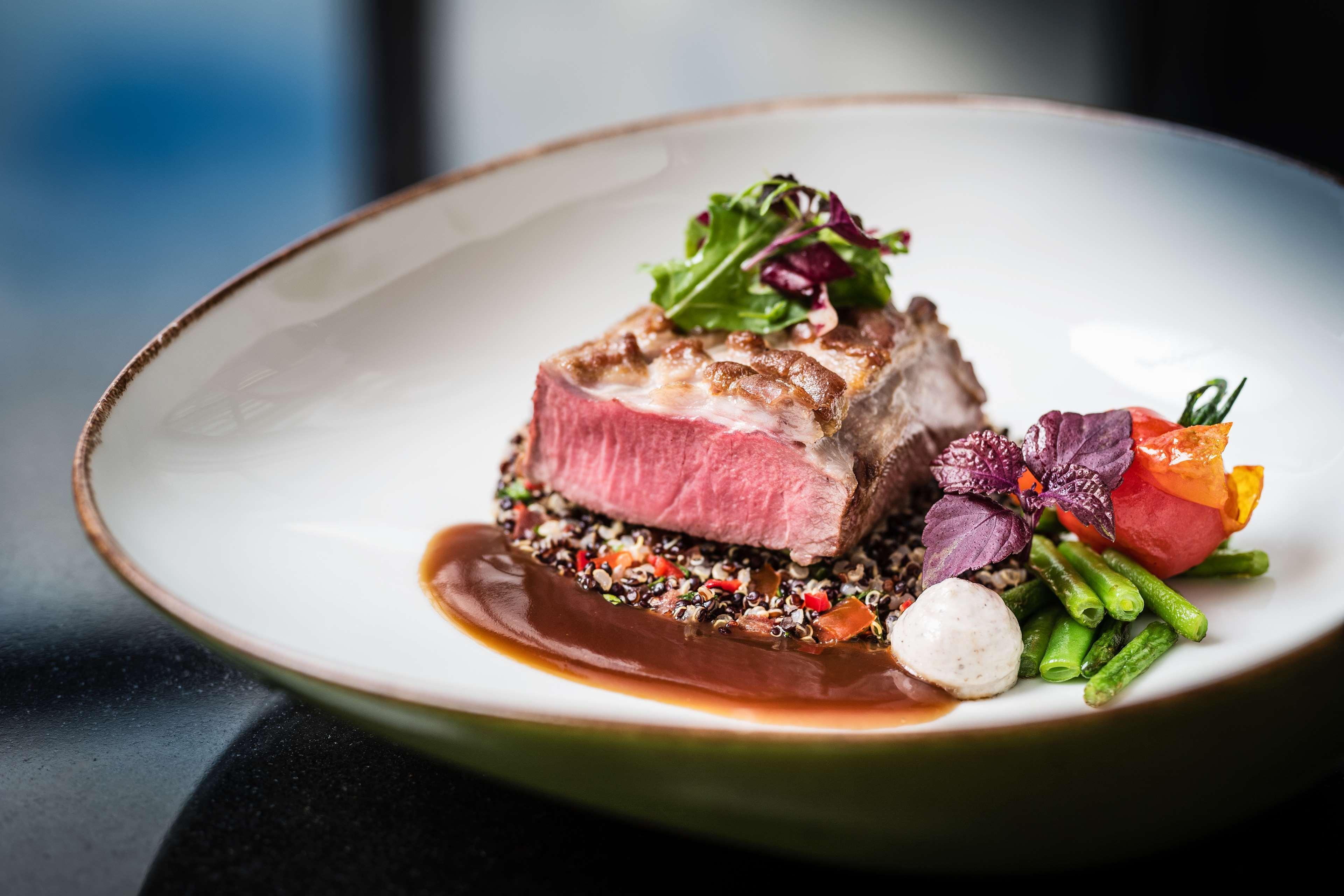 Hotel Hyatt Regency Koeln Exterior foto A steak prepared at the restaurant